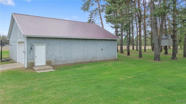 view of outdoor structure with a garage and an outbuilding