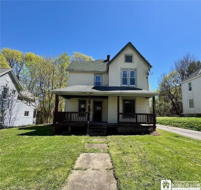 view of front of property featuring a porch and a front lawn