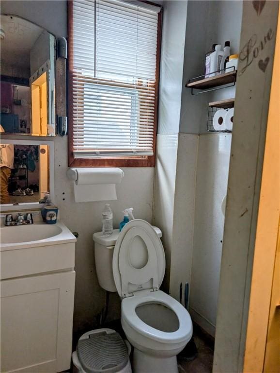 bathroom featuring vanity and toilet