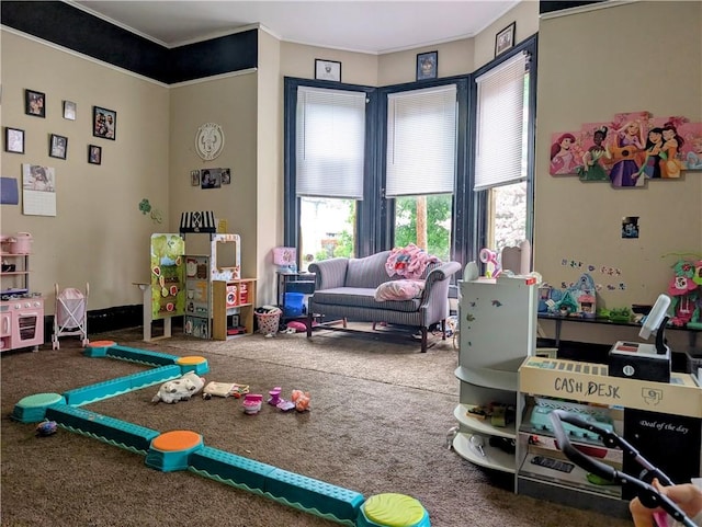 rec room featuring plenty of natural light, carpet floors, and ornamental molding