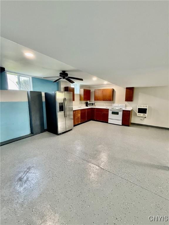 5567 W Lake Rd, Fleming, NY 13021 - kitchen featuring a ceiling fan, light countertops, light speckled floor, heating unit, and stainless steel appliances