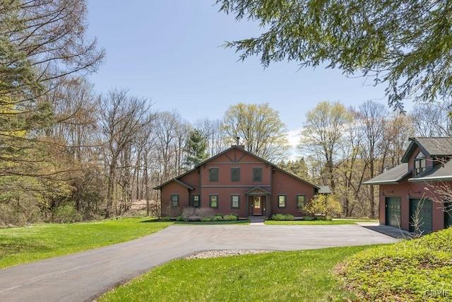3830 Rippleton Rd, Cazenovia, NY 13035 - rustic home with a garage, a front lawn, and aphalt driveway