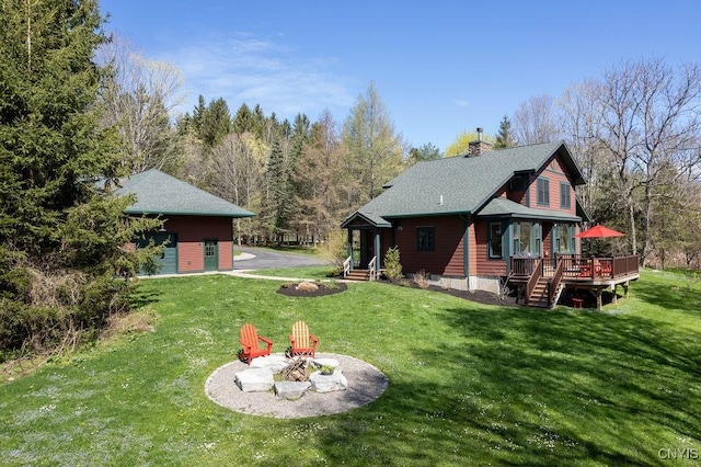 3830 Rippleton Rd, Cazenovia, NY 13035 - rear view of house with an outdoor fire pit, a wooden deck, a yard, and a chimney