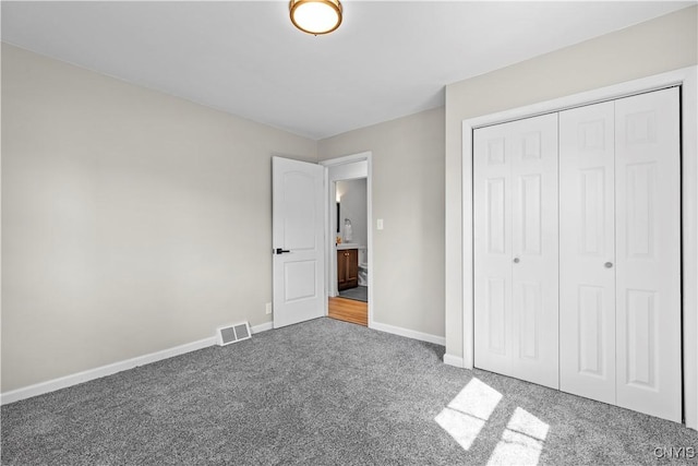 407 Montrose Ave, Geddes, NY 13219 - unfurnished bedroom featuring carpet flooring, baseboards, visible vents, and a closet