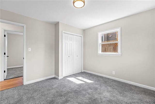 407 Montrose Ave, Geddes, NY 13219 - unfurnished bedroom featuring carpet floors, baseboards, and a closet