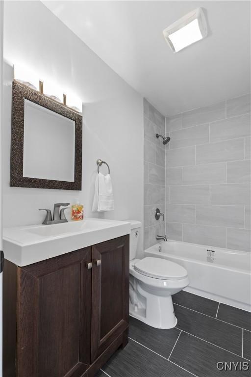 407 Montrose Ave, Geddes, NY 13219 - bathroom featuring vanity, shower / bath combination, and toilet