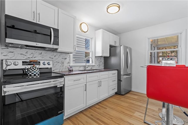 407 Montrose Ave, Geddes, NY 13219 - kitchen with a sink, backsplash, stainless steel appliances, and a healthy amount of sunlight