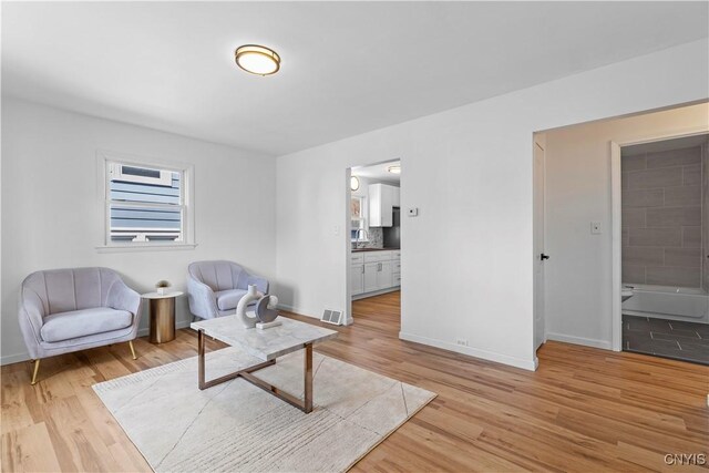 407 Montrose Ave, Geddes, NY 13219 - sitting room with light wood-style floors, baseboards, and visible vents