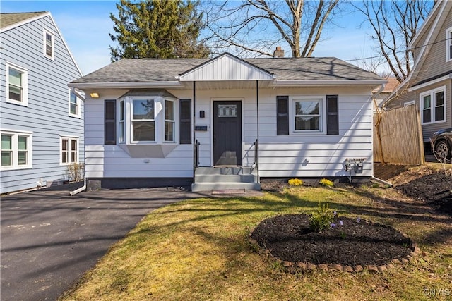 407 Montrose Ave, Geddes, NY 13219 - bungalow-style home with a shingled roof, a front lawn, and entry steps