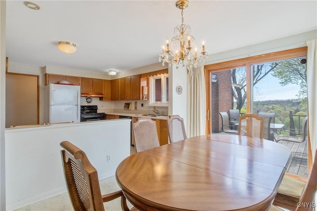 dining area with baseboards and a notable chandelier