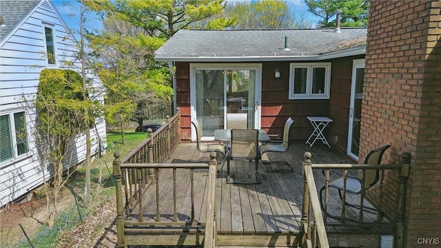 wooden deck featuring outdoor dining area