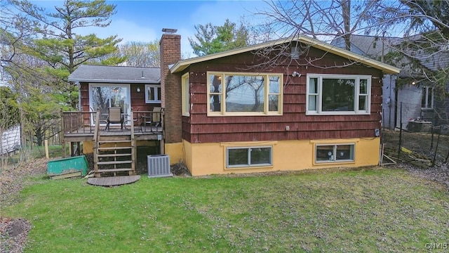 back of house with a chimney, a deck, central air condition unit, a yard, and stairs
