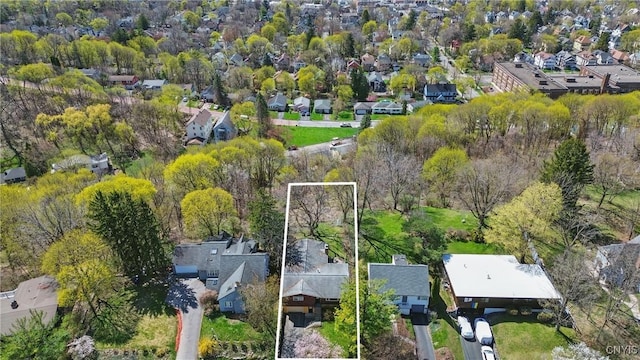 birds eye view of property with a residential view