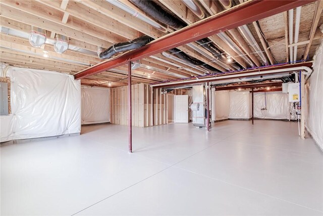 unfinished basement with water heater, heating unit, and electric panel