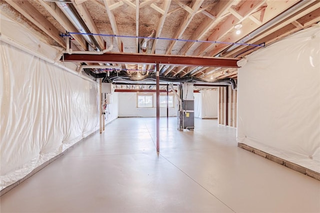 below grade area featuring heating unit