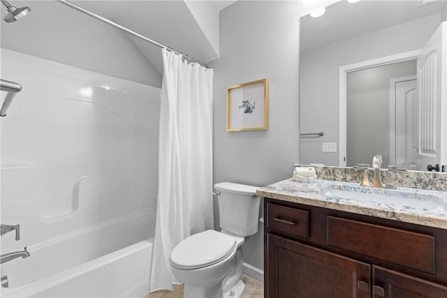 bathroom featuring vanity, baseboards, shower / bath combo, and toilet
