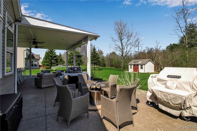 view of patio / terrace with a ceiling fan, an outbuilding, central AC unit, and outdoor lounge area