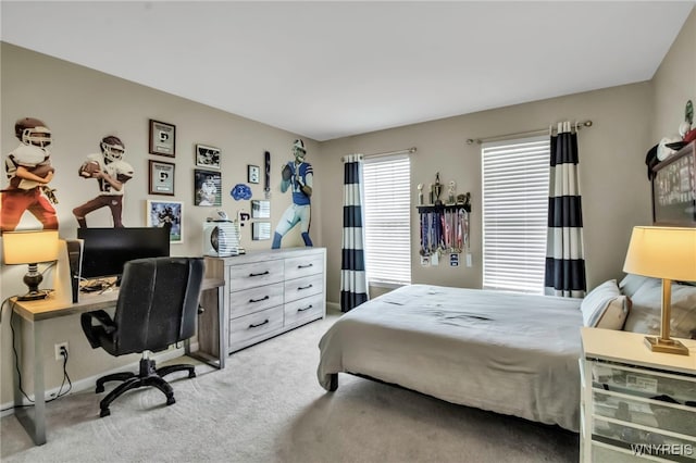 carpeted bedroom featuring baseboards
