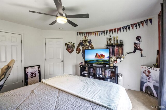 carpeted bedroom featuring ceiling fan