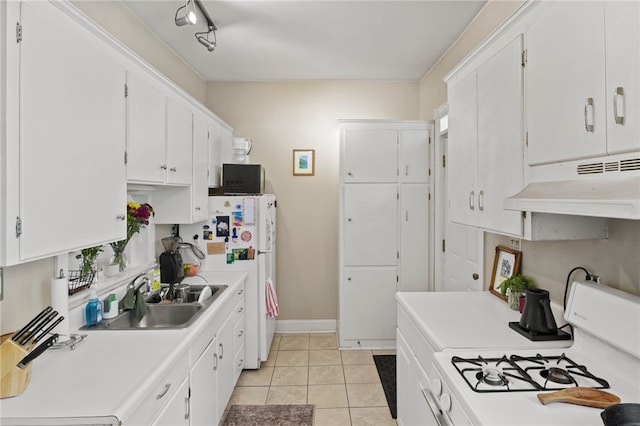 kitchen featuring a sink, light countertops, under cabinet range hood, white appliances, and white cabinetry