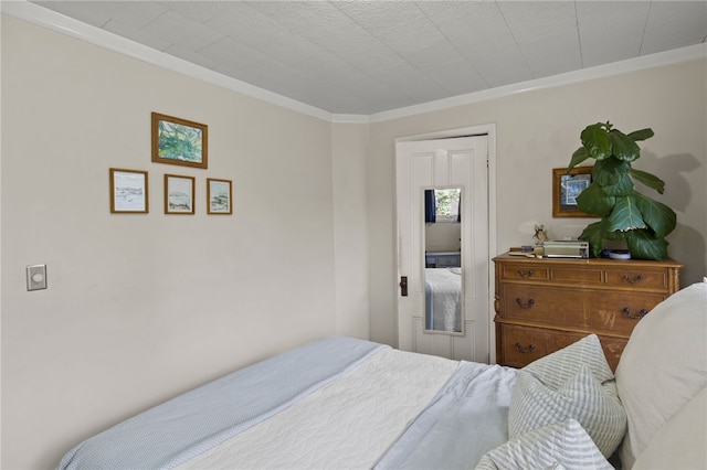 bedroom featuring crown molding