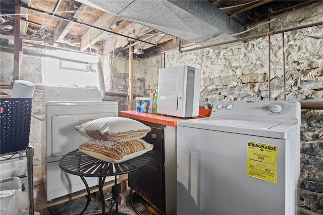 laundry room featuring washing machine and clothes dryer and laundry area