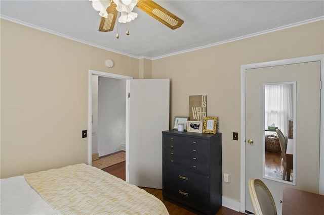 bedroom with crown molding, dark wood-type flooring, and ceiling fan