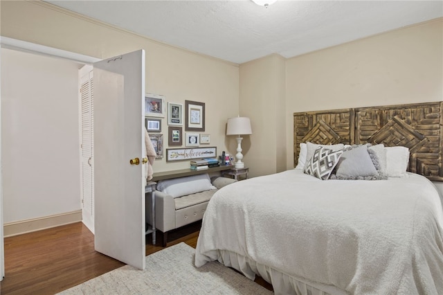 bedroom with wood finished floors