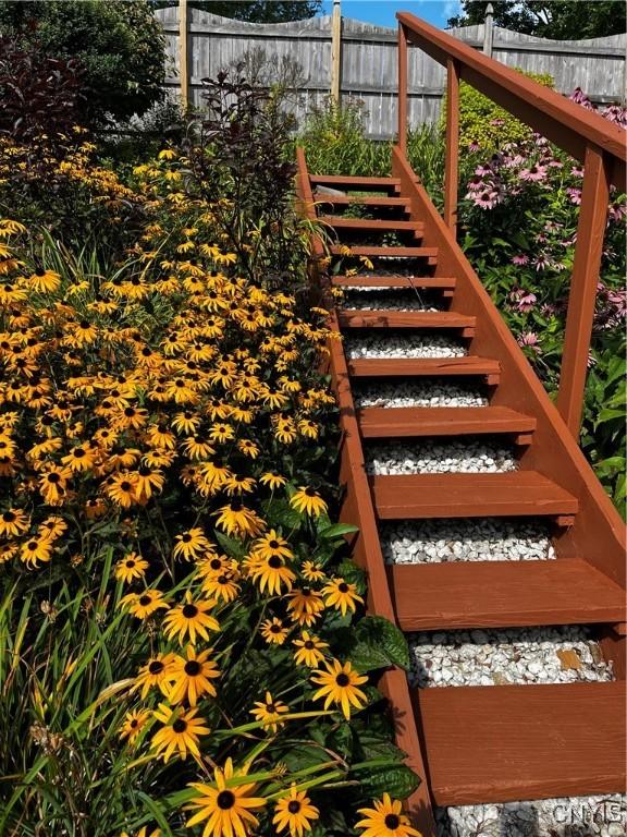 wooden terrace with fence and stairs