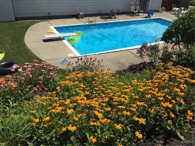 view of pool with a fenced in pool and a patio area