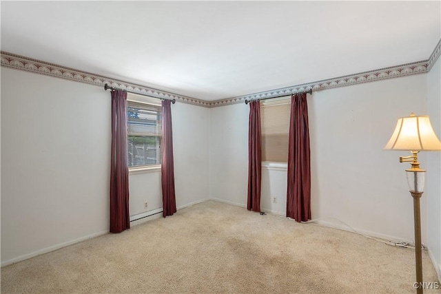 carpeted empty room featuring a baseboard heating unit
