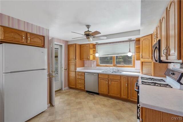 kitchen featuring open shelves, freestanding refrigerator, gas range oven, and dishwasher