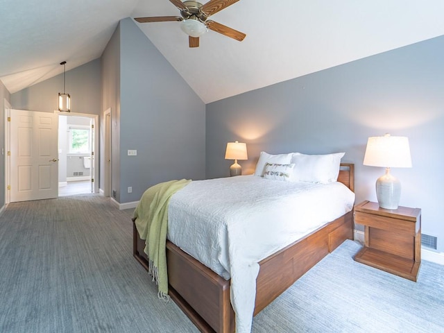 carpeted bedroom with ceiling fan, visible vents, vaulted ceiling, baseboards, and ensuite bathroom