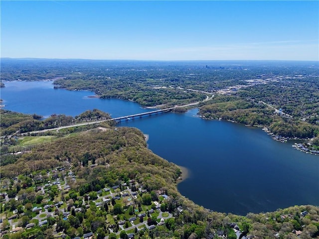 birds eye view of property featuring a water view and a forest view