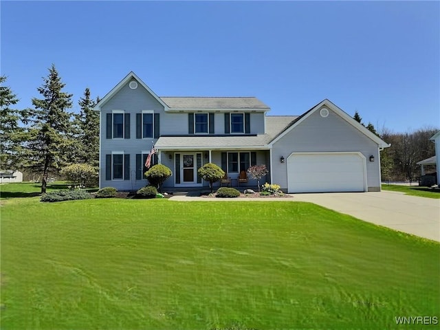 view of front of property with concrete driveway, a front yard, covered porch, and a garage