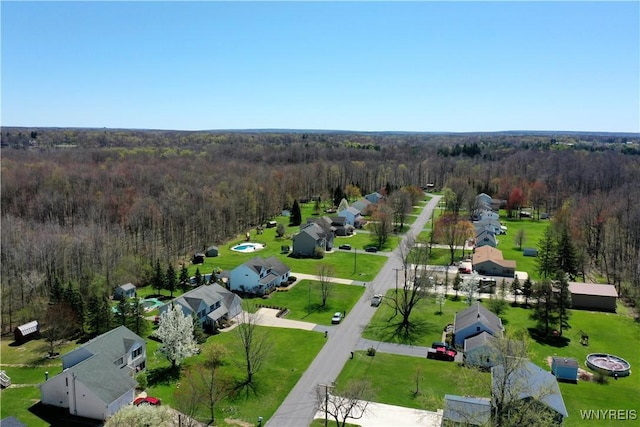 aerial view featuring a view of trees and a residential view