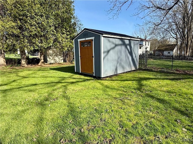view of shed with fence