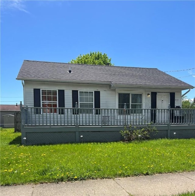 510 Harper St, Elmira-City, NY 14901 - view of front facade with roof with shingles, a wooden deck, and a front yard
