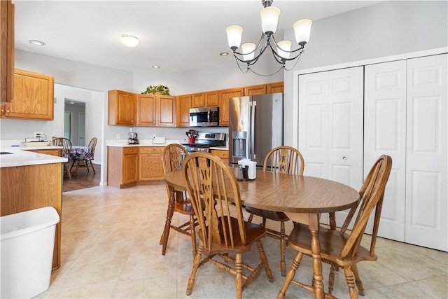 dining room featuring recessed lighting, light tile patterned flooring, and a chandelier