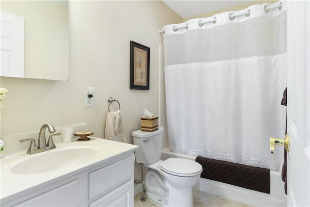 bathroom featuring toilet, shower / tub combo with curtain, and vanity