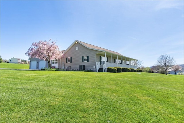 view of property exterior featuring covered porch, a yard, and central AC