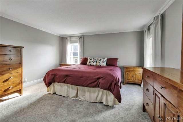 bedroom with light colored carpet, baseboards, and crown molding