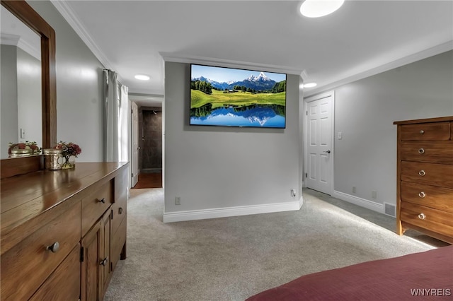 bedroom featuring crown molding, baseboards, visible vents, and light carpet