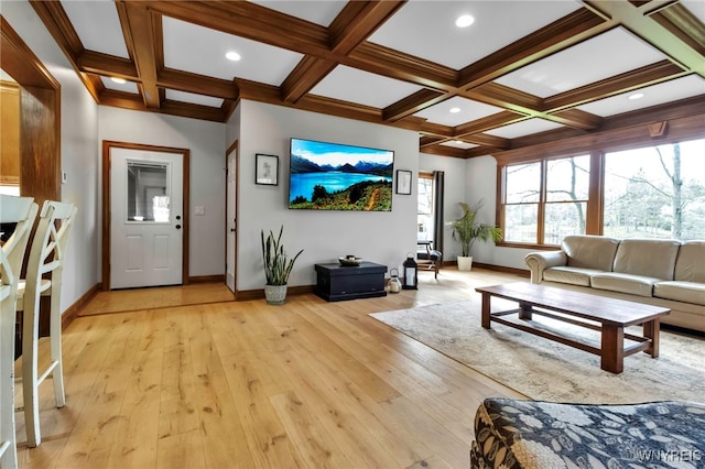 living room featuring baseboards, beamed ceiling, coffered ceiling, and light wood finished floors