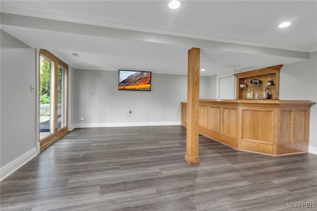 bar featuring baseboards, ornamental molding, recessed lighting, and wood finished floors