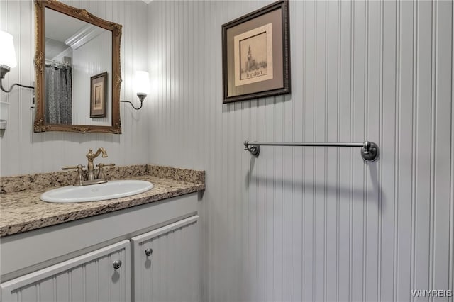 bathroom with vanity and curtained shower