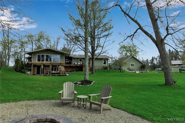 view of yard with a fire pit