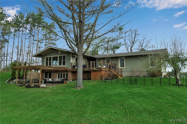 rear view of property with a lawn, a patio, stairs, and a deck