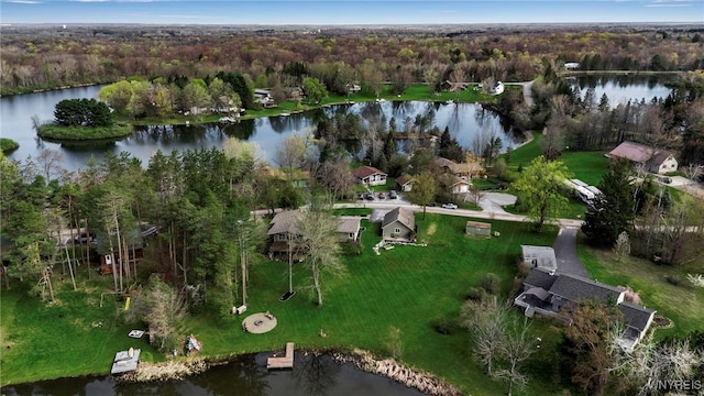 bird's eye view featuring a water view and a wooded view