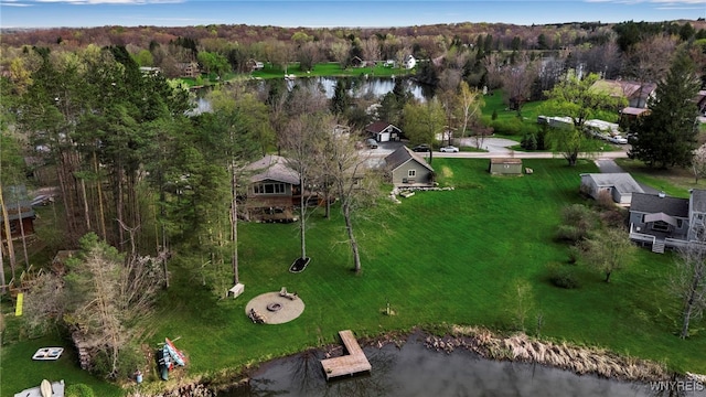 drone / aerial view with a water view and a wooded view